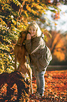 woman and Rhodesian Ridgebacks