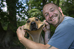 man and Rhodesian Ridgeback