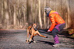 woman with Rhodesian Ridgeback