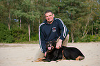 man and Rottweiler