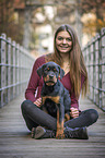 woman with Rottweiler Puppy