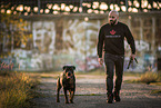 man and Rottweiler