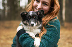 woman and Sheltie puppy