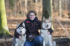 woman and 2 Siberian Husky