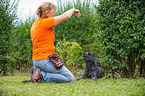 woman and Tibetan terrier