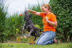 woman and Tibetan terrier