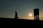 woman and Weimaraner