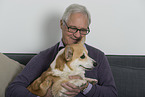 man and Welsh Corgi Pembroke