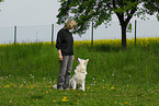 woman and white swiss shepherd