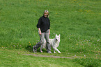 woman and white swiss shepherd