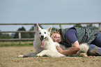 woman with White Swiss Shepherd