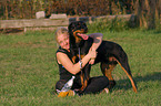 young woman with Rottweiler