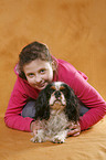 girl with King Charles Spaniel