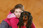 girl with King Charles Spaniel