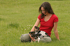 woman with Jack Russell Terrier puppies