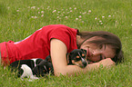 woman with Jack Russell Terrier puppies