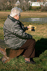 woman looking at dog picture