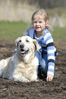 girl with golden retriever