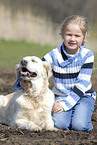 girl with golden retriever