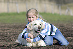 girl with golden retriever