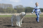 girl with golden retriever