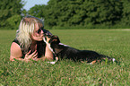 woman kisses mongrel puppy