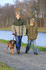 kids walk a dog