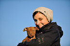 woman with young Pitbull-mongrel