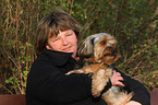 woman and Yorkshire-Terrier-Mongrel