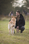 man and Shepherd-Husky