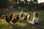 Child with chickens