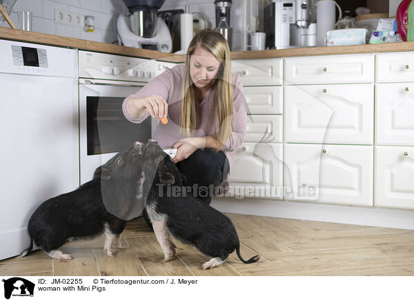 woman with Mini Pigs / JM-02255