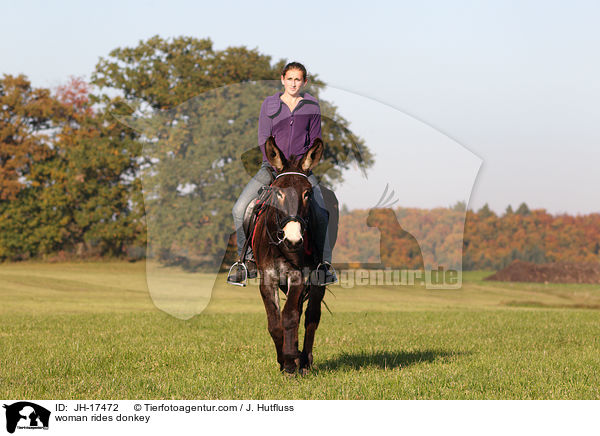 woman rides donkey / JH-17472