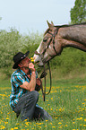 man and American Paint Horse