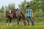 man and American Paint Horse