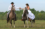 2 riders with horses