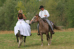 2 riders with horses
