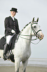 woman rides Andalusian horse
