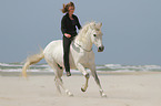 woman rides Andalusian Horse