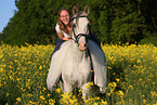 woman rides arabian horse