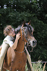 woman rides arabian horse