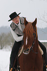 woman rides arabian horse