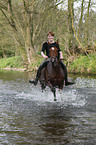 woman rides arabian horse