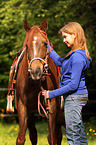 woman and arabian horse