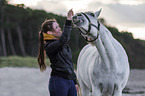 woman and arabian horse