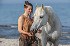 woman and arabian horse