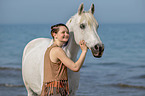 woman and arabian horse