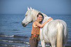 woman and arabian horse