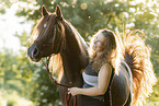 woman and arabian horse