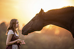 woman and Austrian warmblood